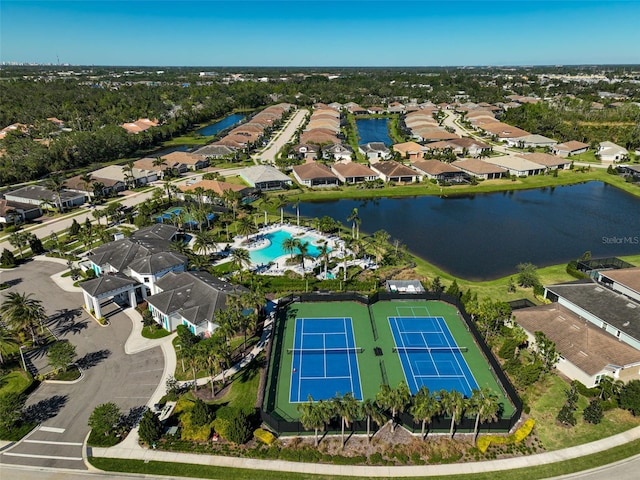 bird's eye view featuring a residential view and a water view