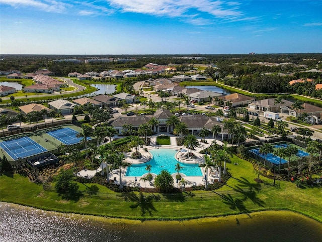 drone / aerial view with a residential view and a water view