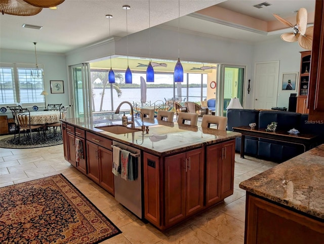 kitchen with a sink, visible vents, a ceiling fan, stainless steel dishwasher, and dark stone counters