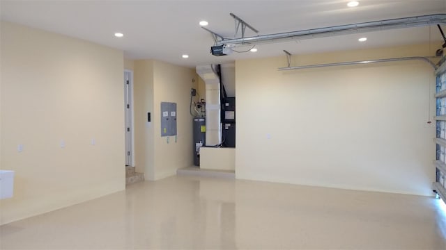 garage featuring electric panel, a garage door opener, electric water heater, heating unit, and recessed lighting