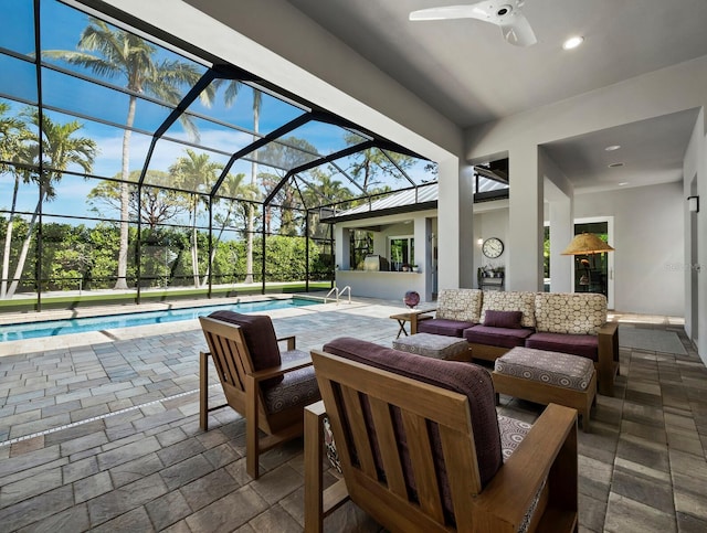 view of patio with a ceiling fan, glass enclosure, outdoor lounge area, and an outdoor pool