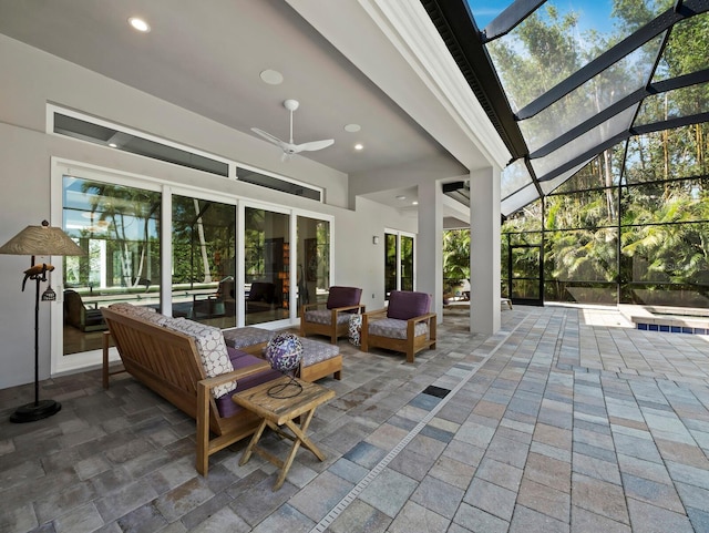 view of patio / terrace with a lanai, ceiling fan, and an outdoor living space