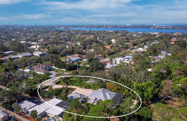 birds eye view of property featuring a water view and a residential view