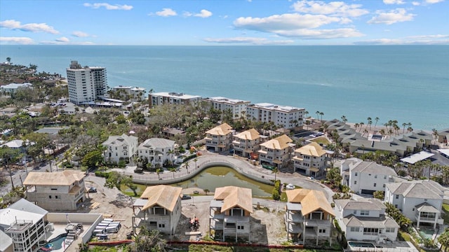 aerial perspective of suburban area with a large body of water