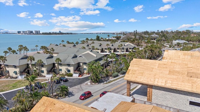 aerial view of residential area featuring a large body of water
