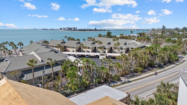 aerial view of residential area featuring a large body of water