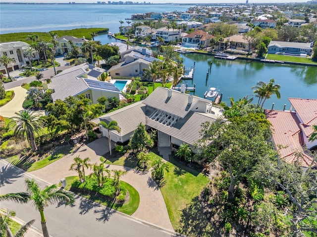 aerial view featuring a residential view and a water view