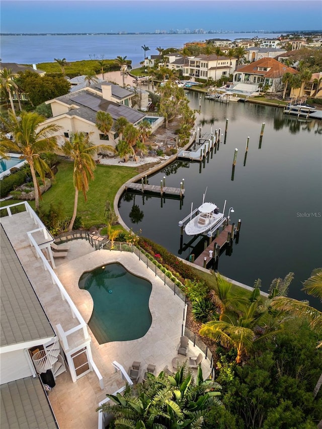 bird's eye view featuring a residential view and a water view