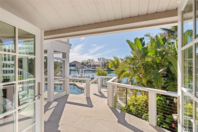 view of patio with a water view