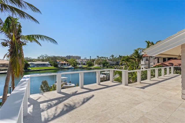 view of swimming pool featuring a water view