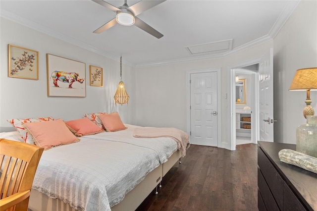 bedroom with dark wood finished floors, attic access, crown molding, and ceiling fan