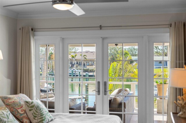 bedroom featuring ornamental molding, a ceiling fan, and access to outside