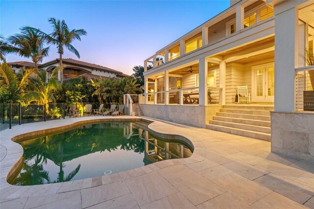 view of pool featuring ceiling fan, fence, a patio, and a fenced in pool