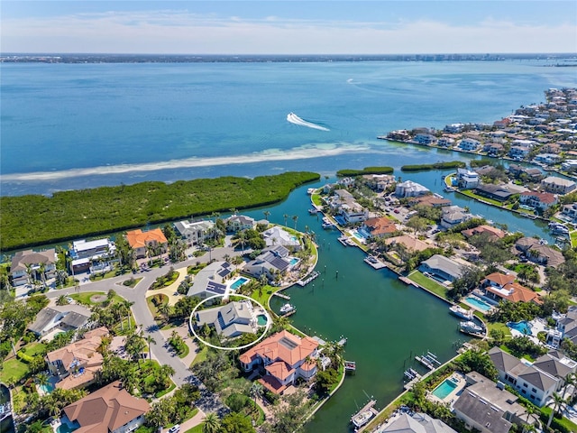 bird's eye view with a residential view and a water view