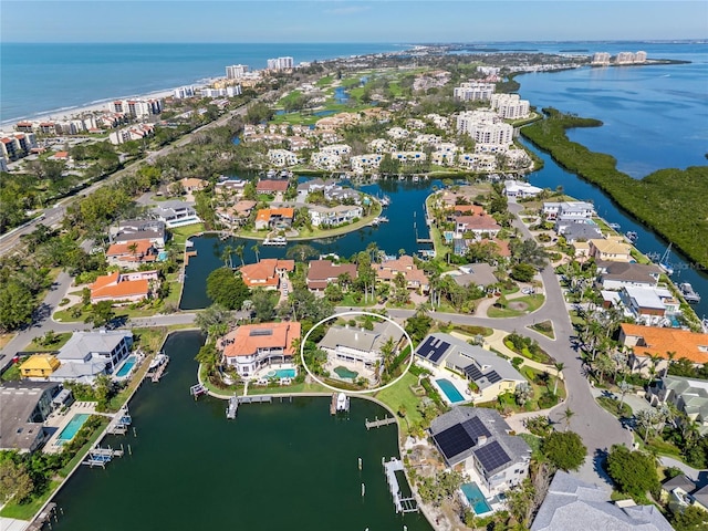 aerial view featuring a residential view and a water view