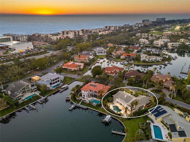 bird's eye view featuring a water view and a residential view