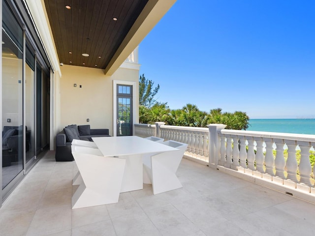 view of patio with a water view