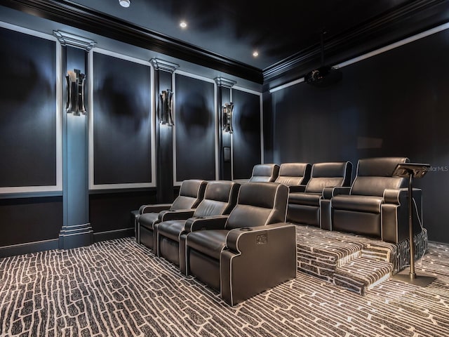 cinema room with carpet flooring and ornamental molding