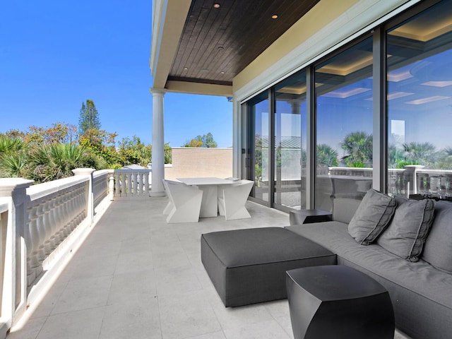 view of patio with a balcony and outdoor lounge area