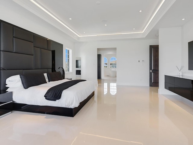 bedroom with recessed lighting and a tray ceiling