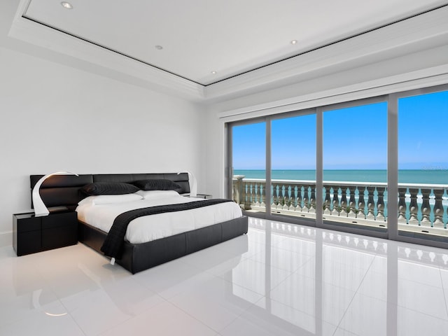 tiled bedroom with recessed lighting, a raised ceiling, and a water view