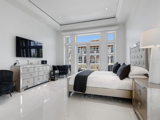 bedroom featuring crown molding, a high ceiling, and a tray ceiling