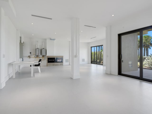 interior space featuring visible vents, recessed lighting, and finished concrete flooring