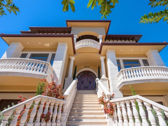 view of front of house with stairs