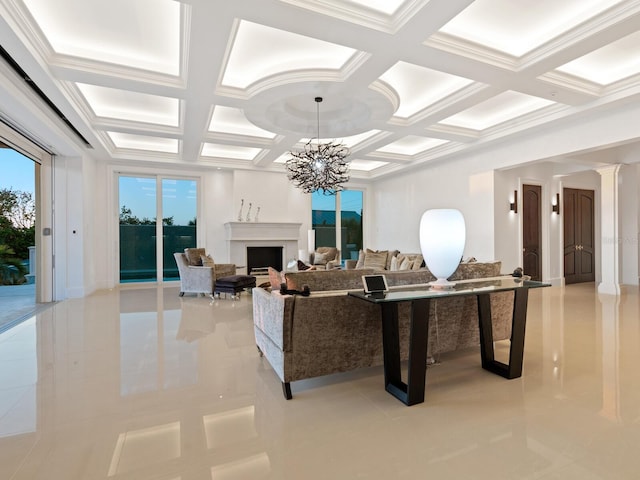 living room with beam ceiling, coffered ceiling, an inviting chandelier, a fireplace, and decorative columns