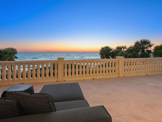 patio terrace at dusk with a water view