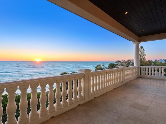 balcony at dusk with a water view