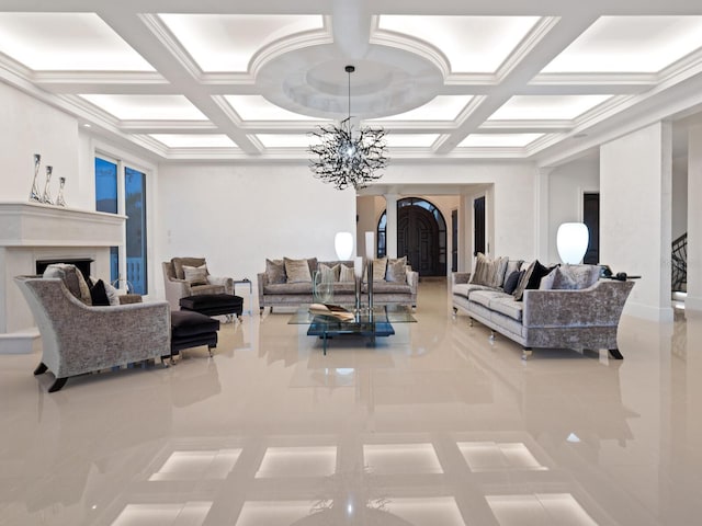 living area featuring a chandelier, a fireplace, coffered ceiling, and arched walkways