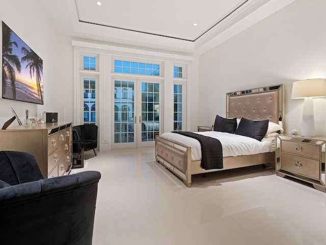 bedroom with a tray ceiling, access to outside, french doors, and crown molding