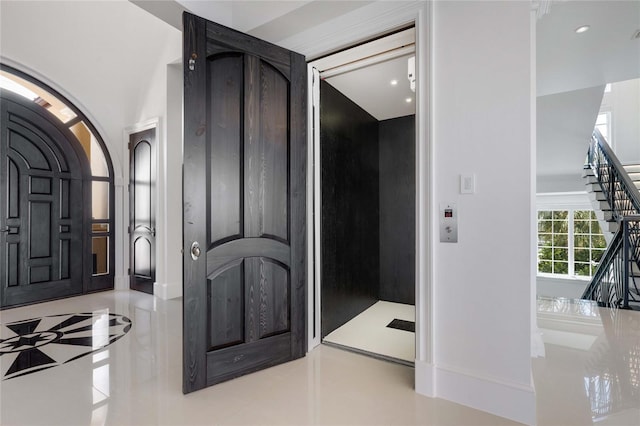 3909 Casey Key Rd, Nokomis, FL 34275 - hallway featuring arched walkways, tile patterned floors, stairway, baseboards, and recessed lighting