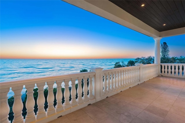 3909 Casey Key Rd, Nokomis, FL 34275 - balcony at dusk featuring a water view