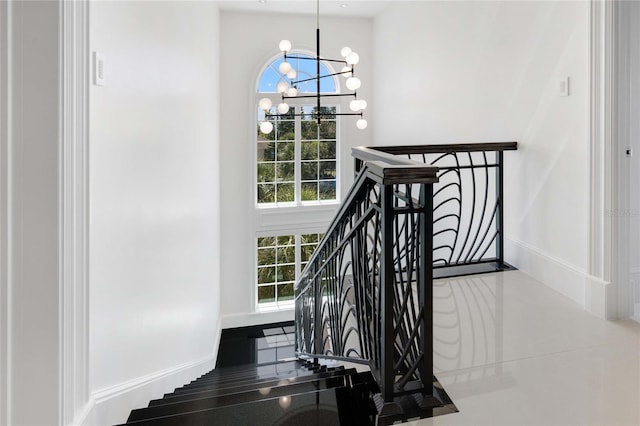 3909 Casey Key Rd, Nokomis, FL 34275 - stairs featuring a chandelier and baseboards