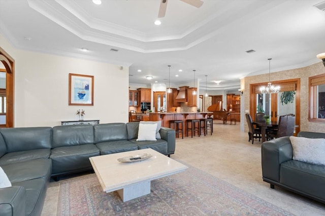 living room featuring recessed lighting, a raised ceiling, and crown molding