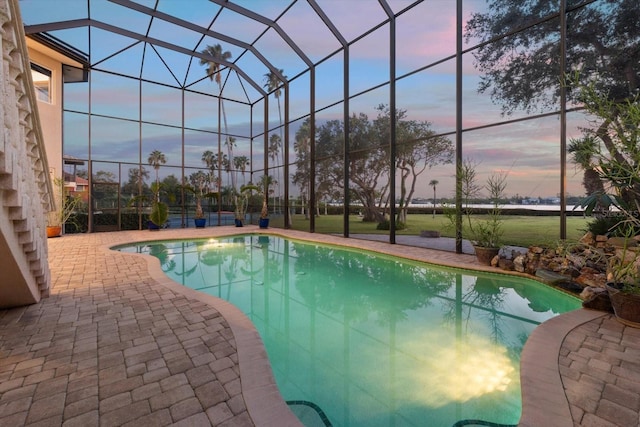 pool with a patio and a lanai