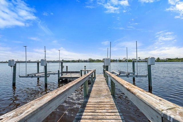 view of dock with a water view and boat lift