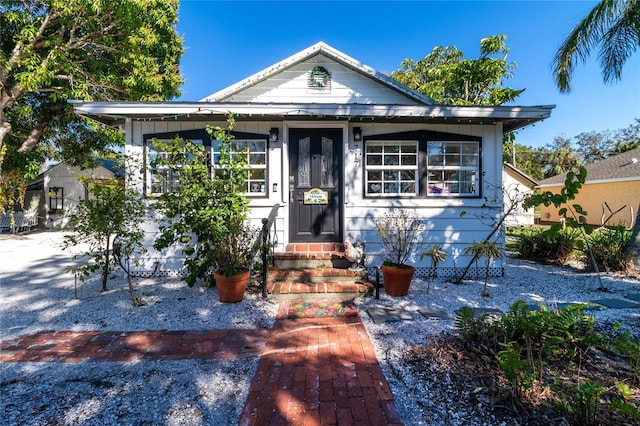 bungalow-style home featuring entry steps