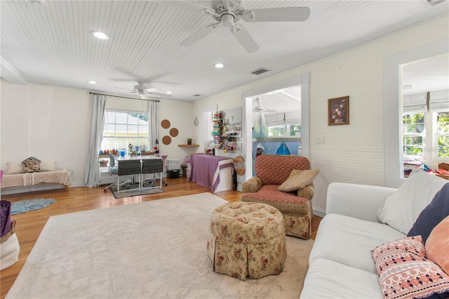 living area featuring wood finished floors, visible vents, and recessed lighting