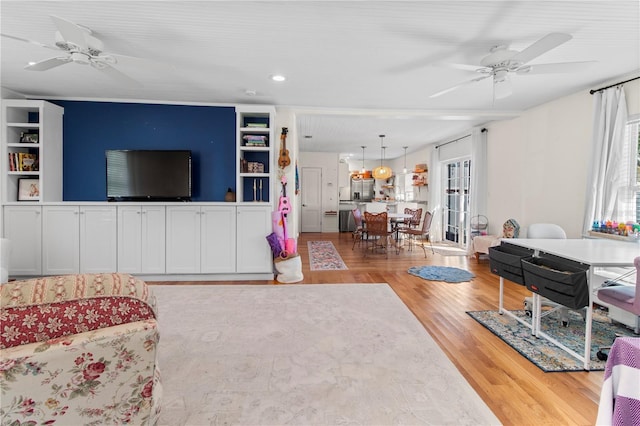 living room featuring ceiling fan and wood finished floors