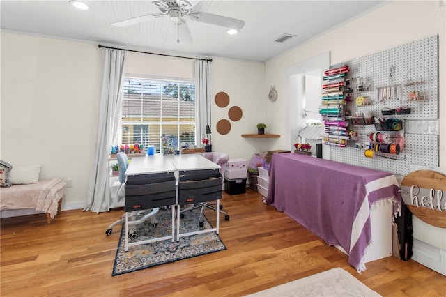 bedroom with a ceiling fan, visible vents, wood finished floors, and recessed lighting