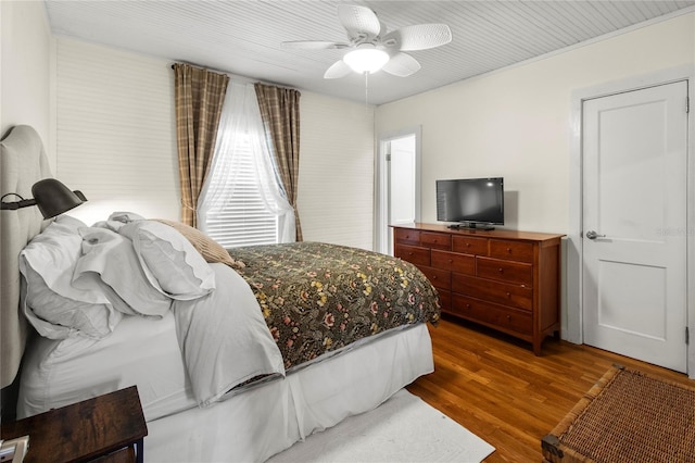 bedroom with ceiling fan and wood finished floors