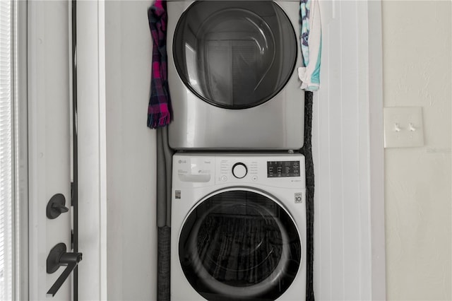 laundry room featuring laundry area and stacked washing maching and dryer