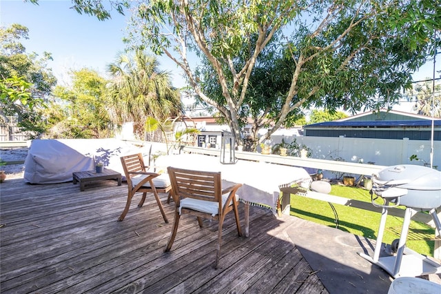 wooden deck featuring fence