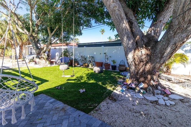 view of yard featuring a patio area and fence