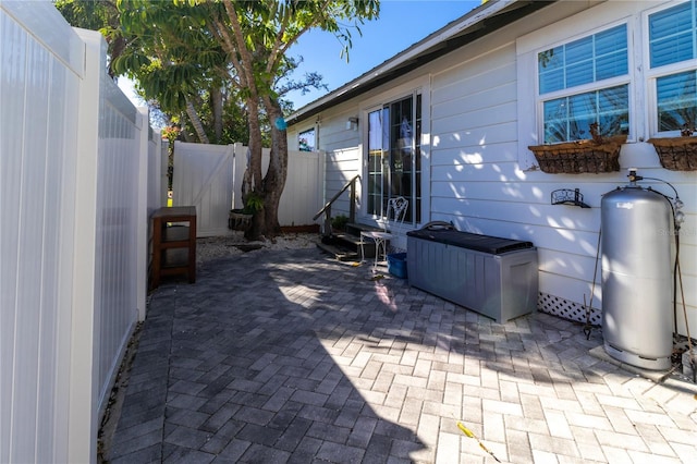 view of patio with entry steps and a fenced backyard