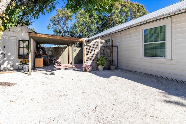 exterior space with fence and a patio