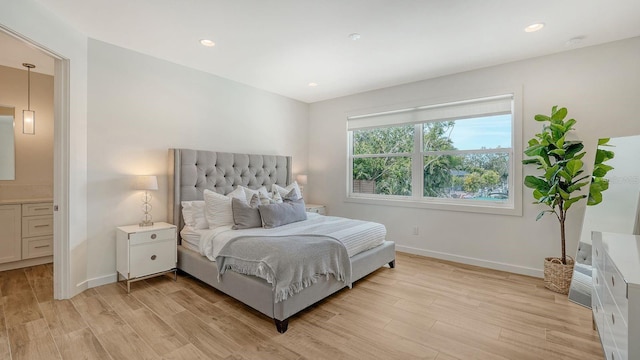 bedroom featuring recessed lighting, light wood-type flooring, and baseboards